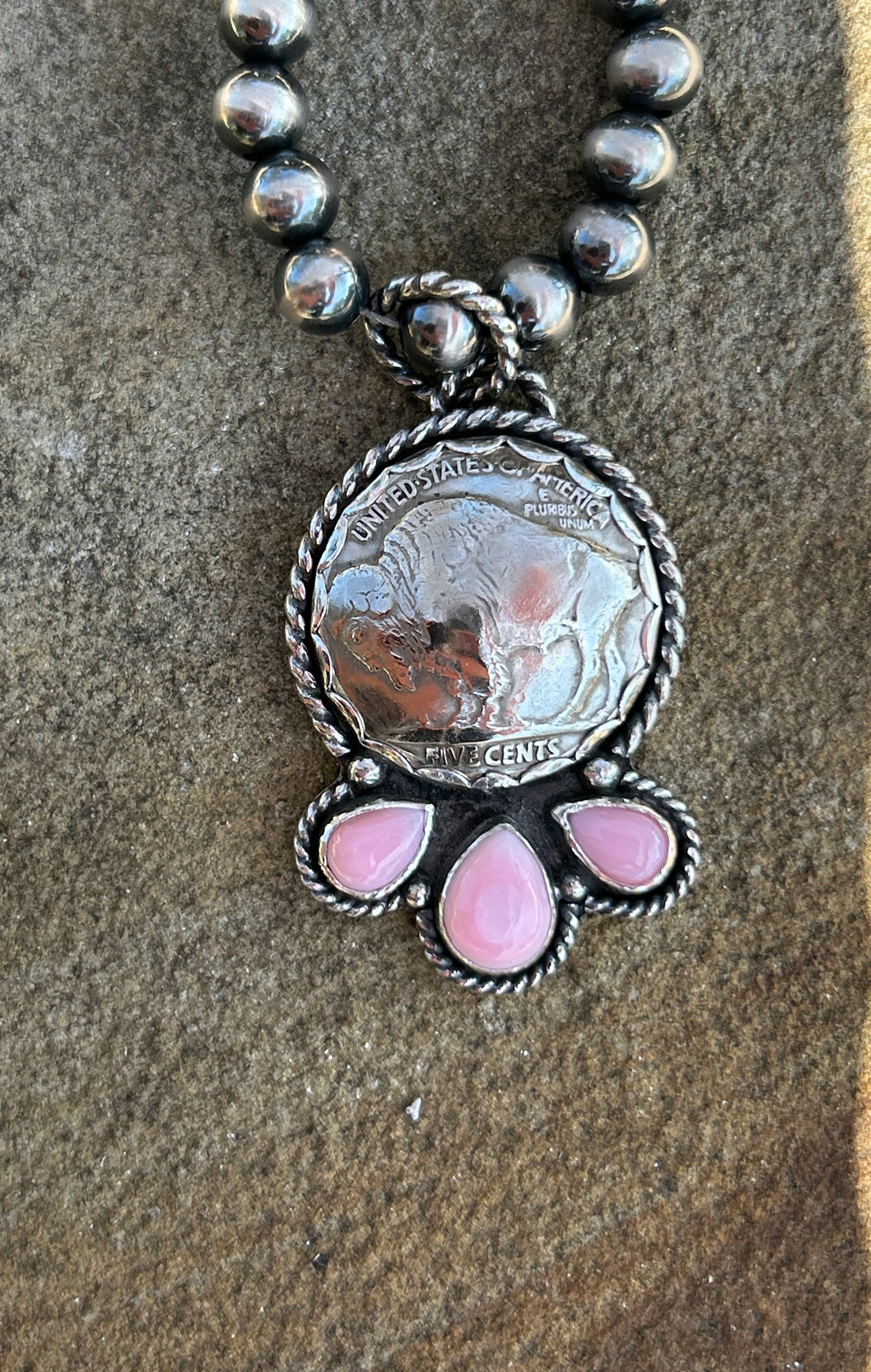 Buffalo nickel and pink conch pendant
