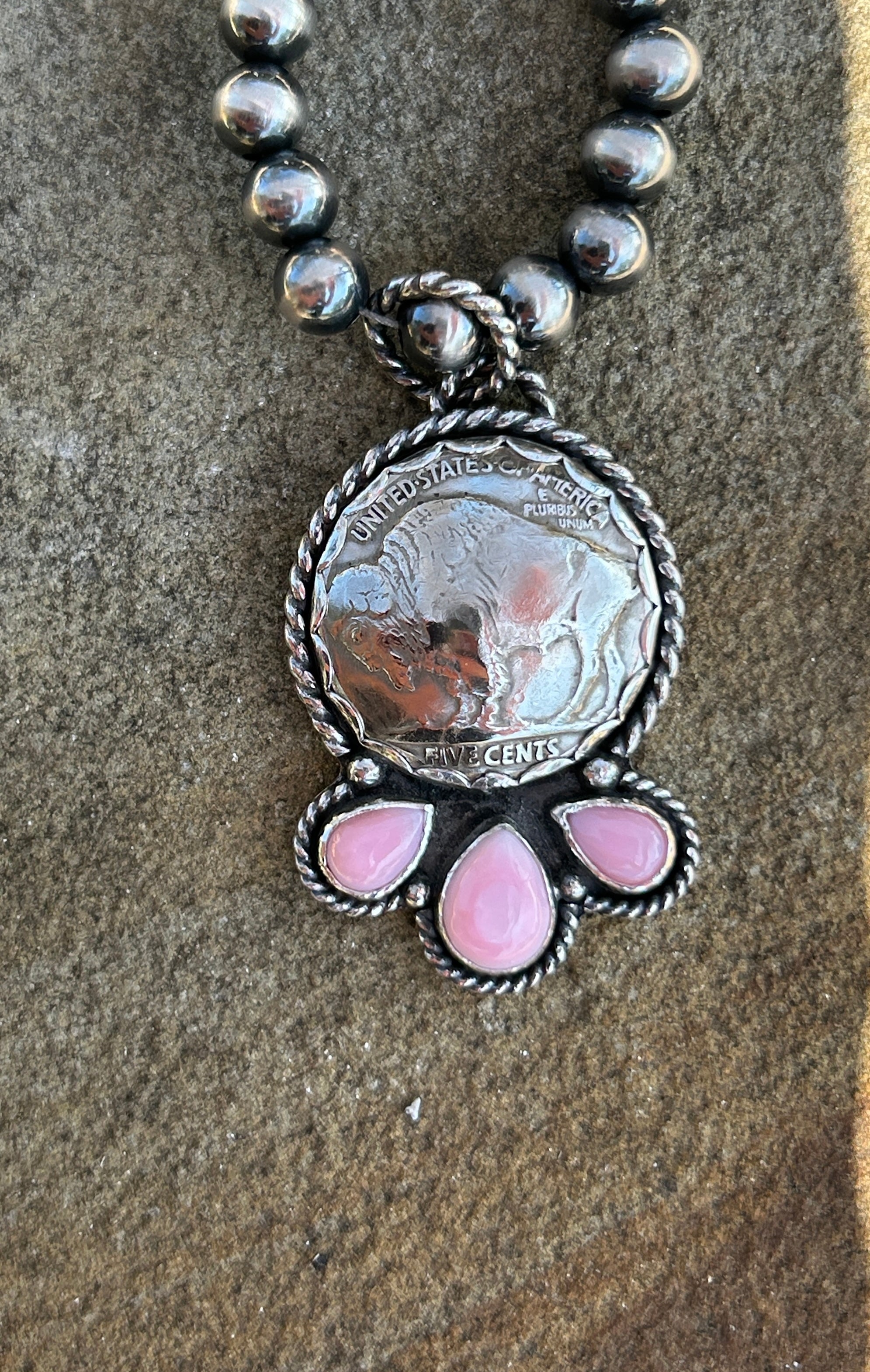 Buffalo nickel and pink conch pendant